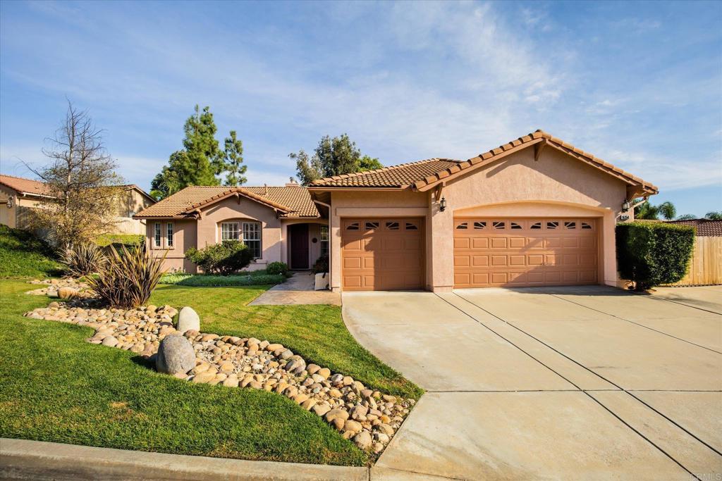 16350 Open View Road Ramona, CA 92065 - Photo 41 of 45 a front view of a house with a garden and yard