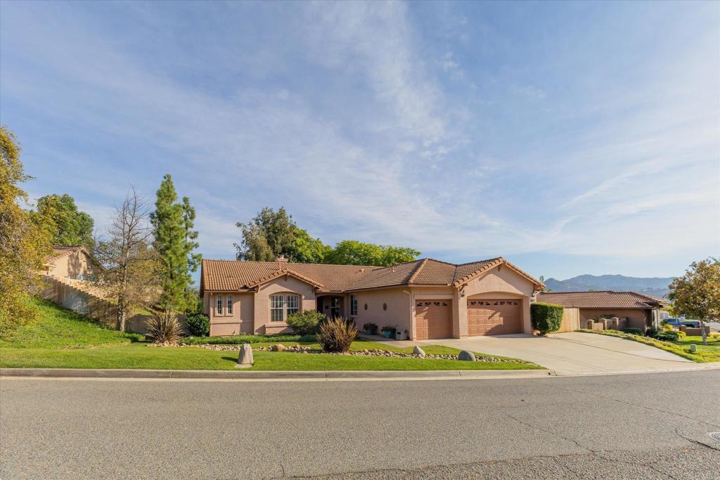 16350 Open View Road Ramona, CA 92065 - Photo 42 of 45 a front view of a house with a yard and a garage