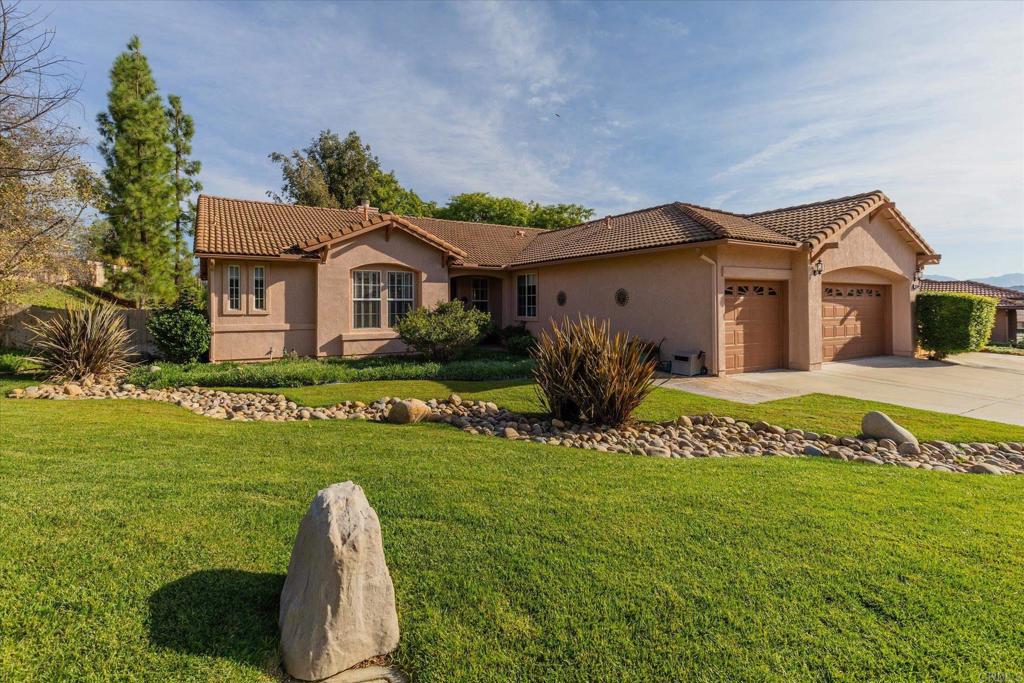 16350 Open View Road Ramona, CA 92065 - Photo 44 of 45 a front view of a house with a garden