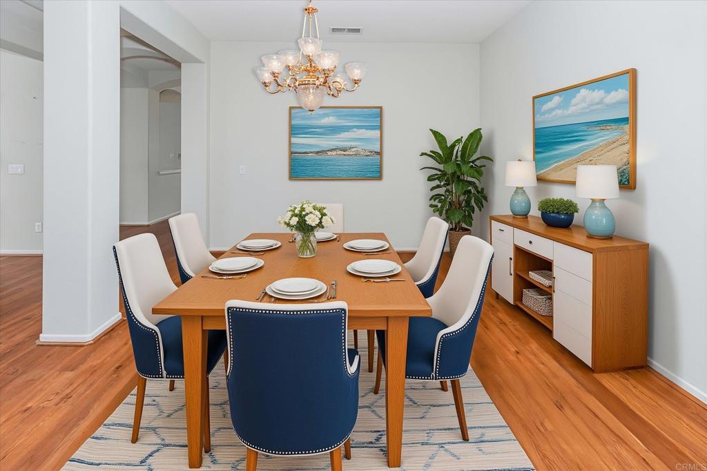 16350 Open View Road Ramona, CA 92065 - Photo 5 of 45 a view of a dining room with furniture wooden floor and chandelier
