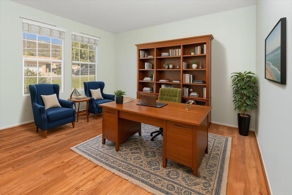 16350 Open View Road Ramona, CA 92065 - Photo 6 of 45 a view of a workspace with furniture bookshelf and a potted plant
