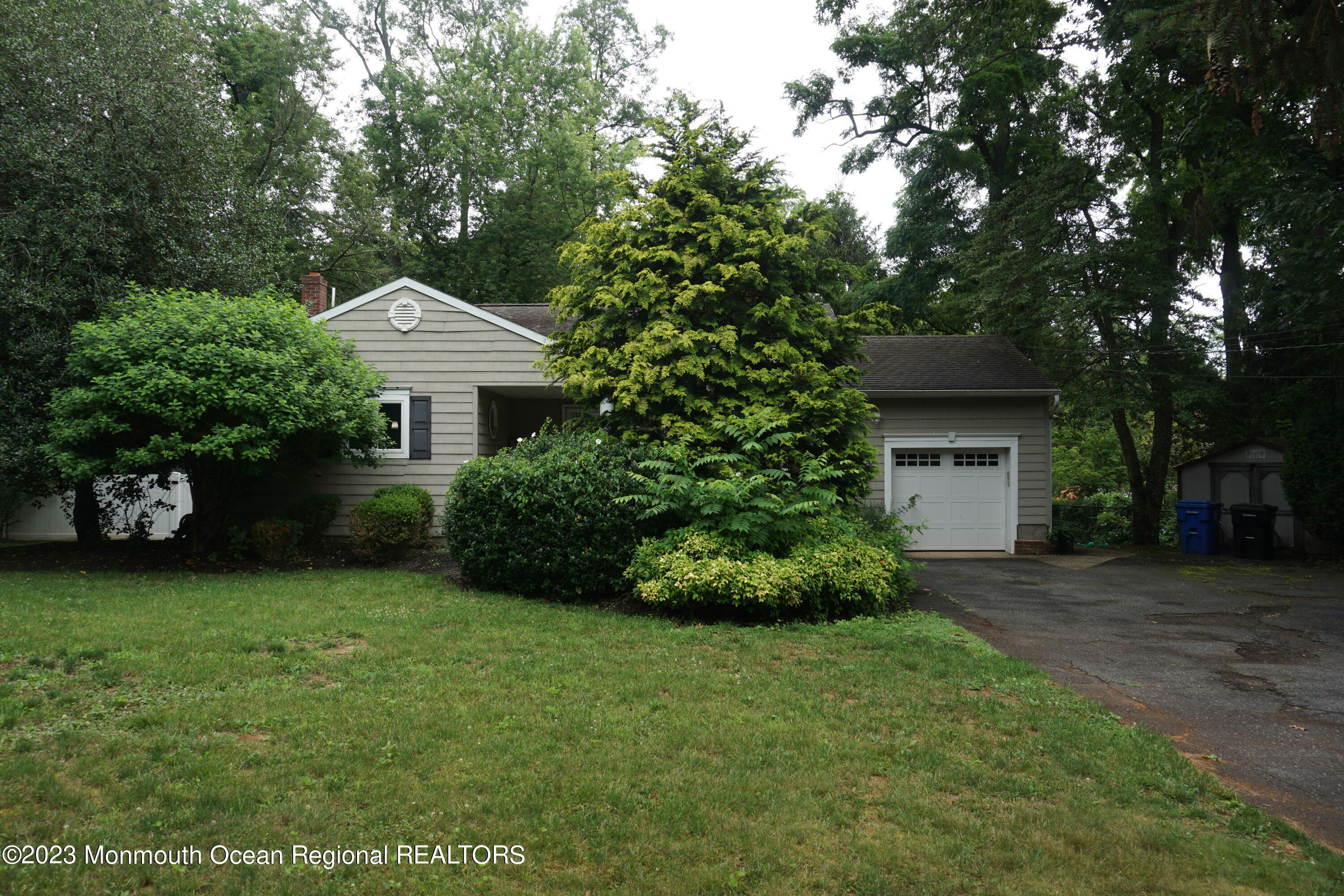 114 Bruce Road Red Bank, NJ 07701 - Photo 1 of 14 a front view of a house with garden