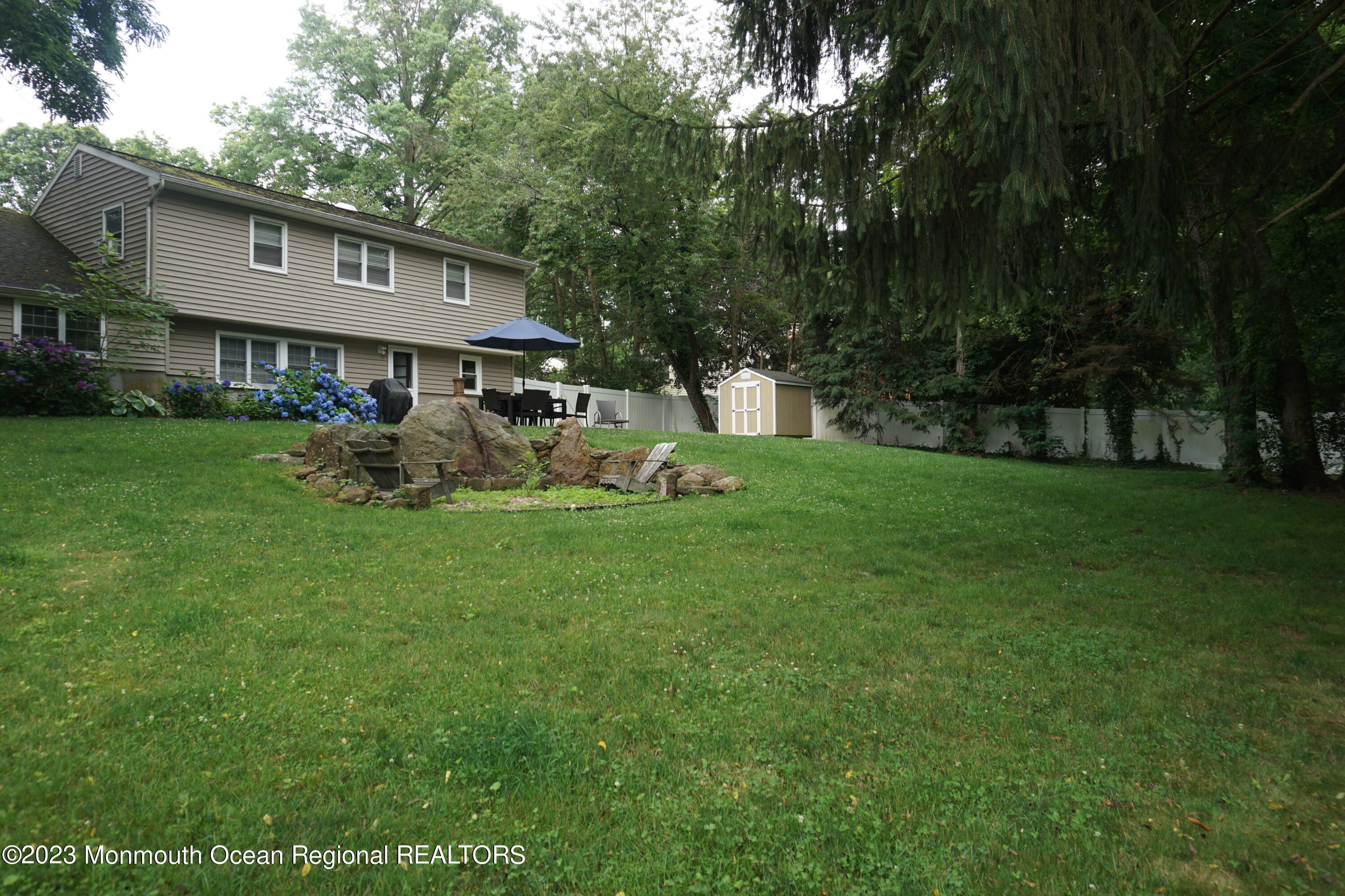 114 Bruce Road Red Bank, NJ 07701 - Photo 12 of 14 a front view of a house with garden