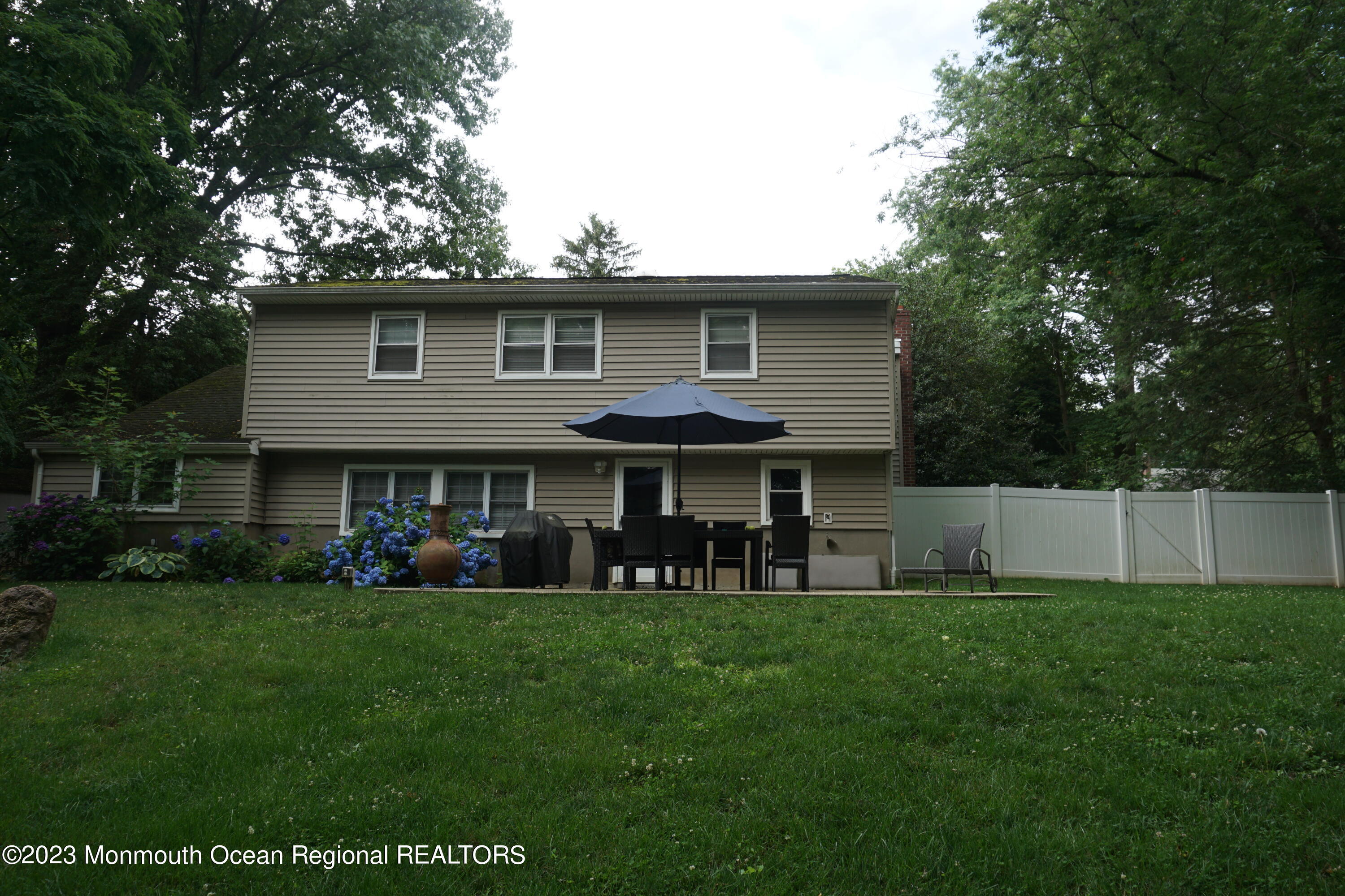 114 Bruce Road Red Bank, NJ 07701 - Photo 14 of 14 a front view of a house with a garden