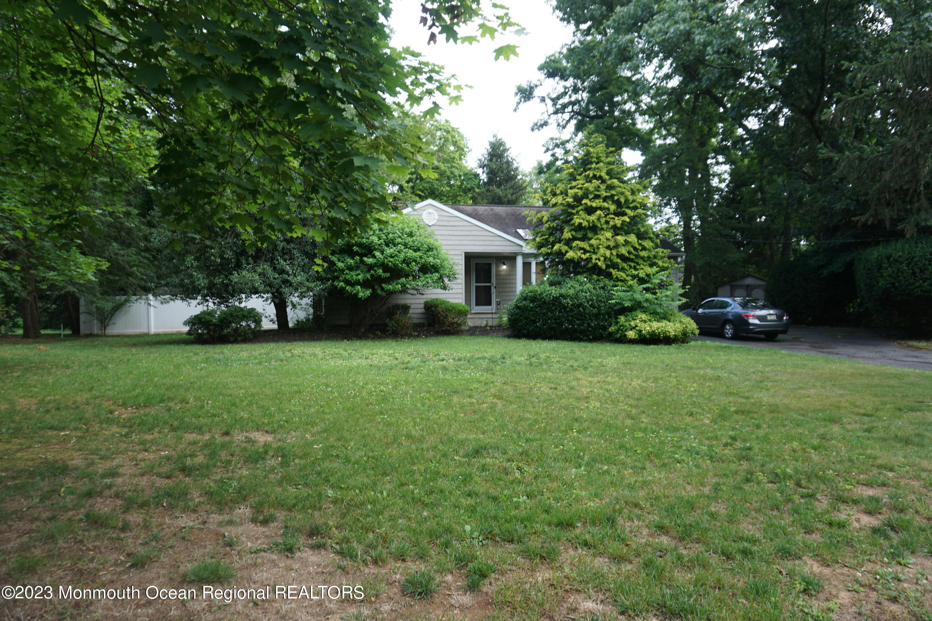 114 Bruce Road Red Bank, NJ 07701 - Photo 2 of 14 a view of a house with a yard