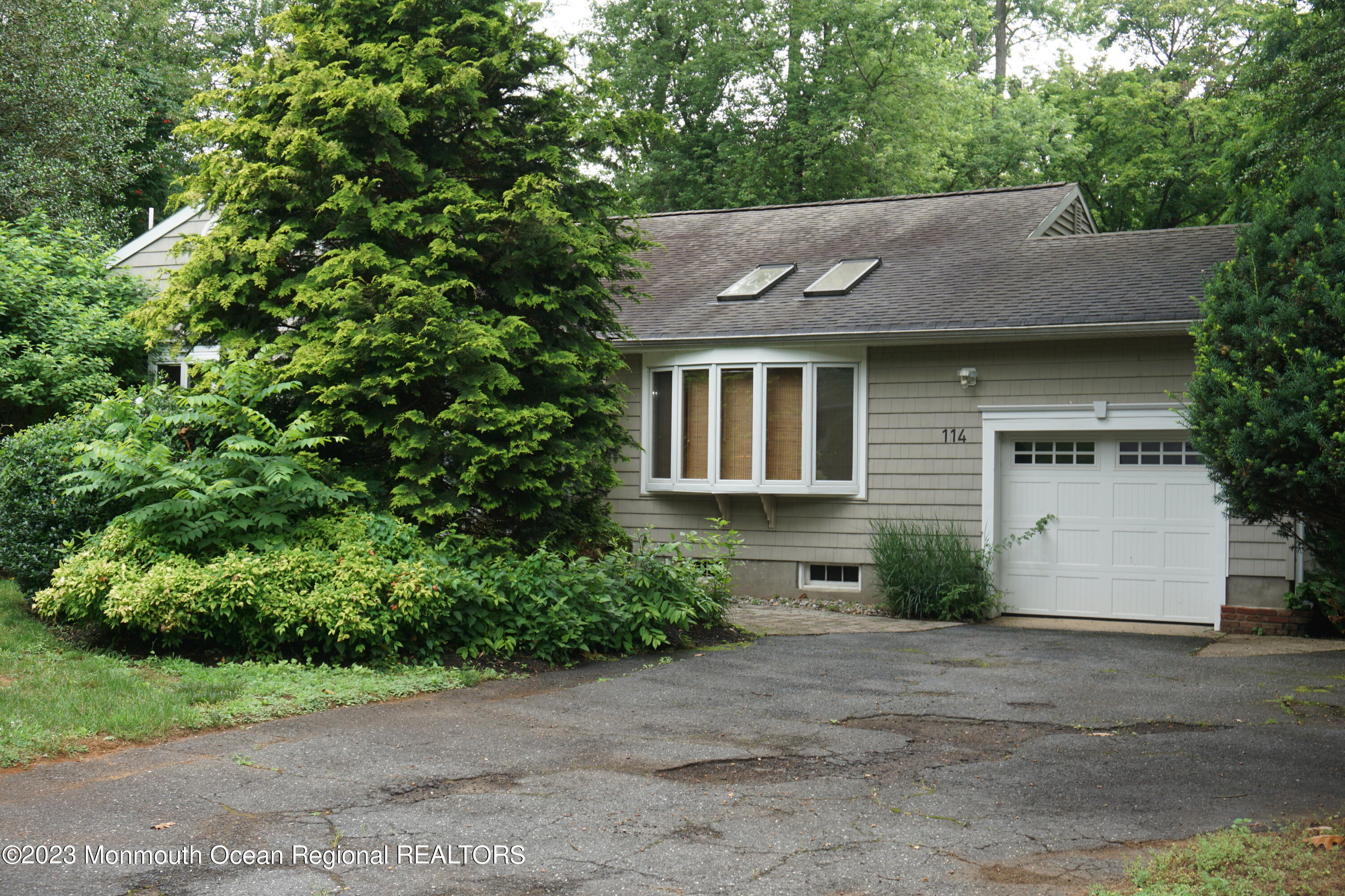 114 Bruce Road Red Bank, NJ 07701 - Photo 3 of 14 a front view of a house with a yard