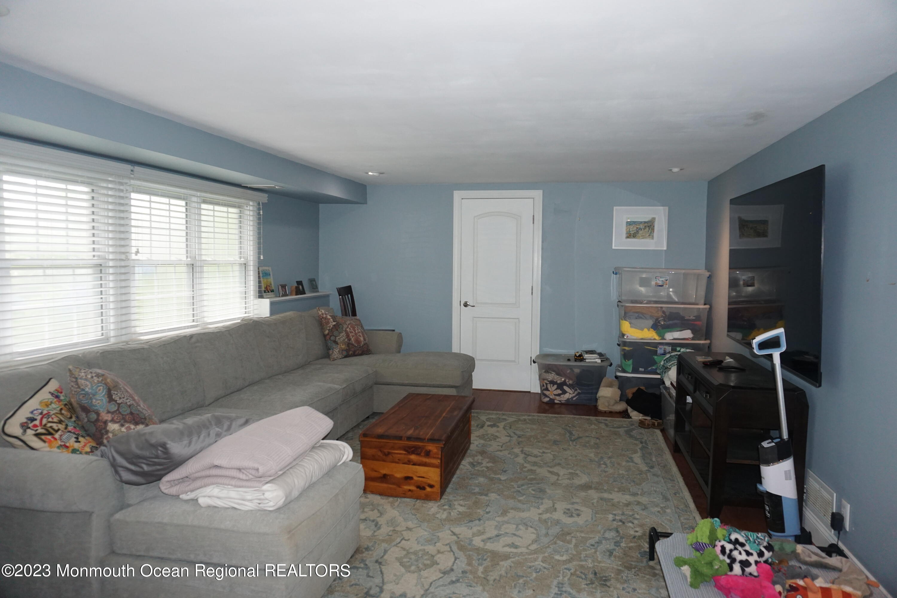 114 Bruce Road Red Bank, NJ 07701 - Photo 10 of 14 a living room with furniture window and a flat screen tv