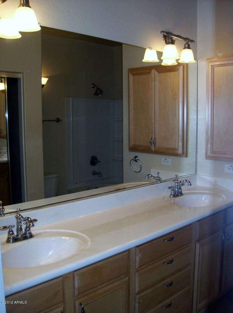 2565 South Signal Butte Road, Unit 39 Mesa, AZ 85209 - Photo 12 of 28 a bathroom with a sink and a mirror