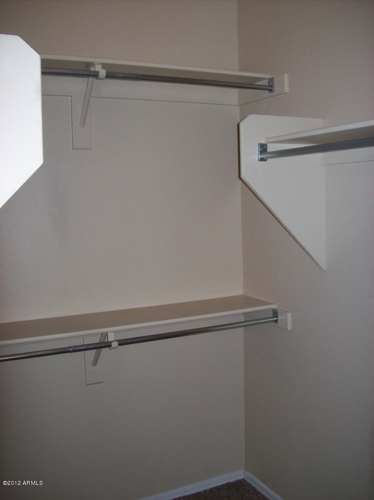 2565 South Signal Butte Road, Unit 39 Mesa, AZ 85209 - Photo 14 of 28 a view of a room with racks on the wall