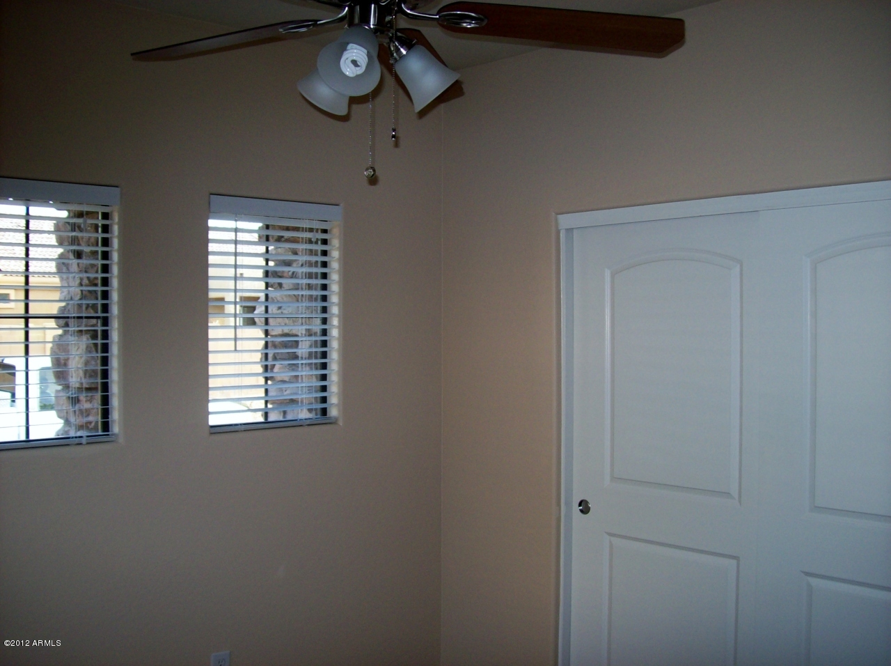 2565 South Signal Butte Road, Unit 39 Mesa, AZ 85209 - Photo 17 of 28 a view of a room with a window and a fan