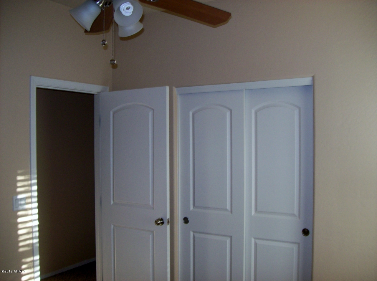 2565 South Signal Butte Road, Unit 39 Mesa, AZ 85209 - Photo 18 of 28 a view of a livingroom with a chandelier fan