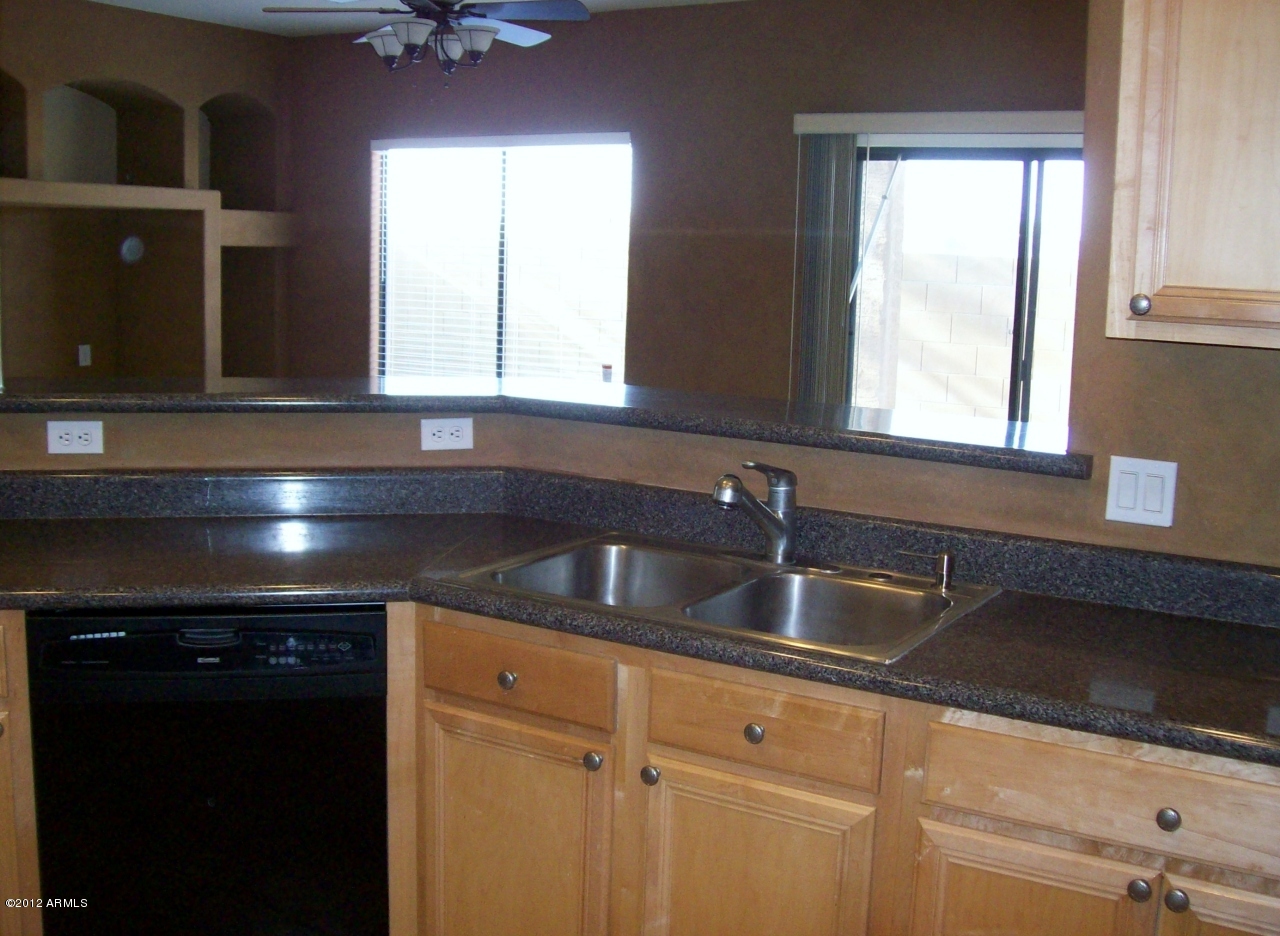 2565 South Signal Butte Road, Unit 39 Mesa, AZ 85209 - Photo 2 of 28 a kitchen with a sink and a window