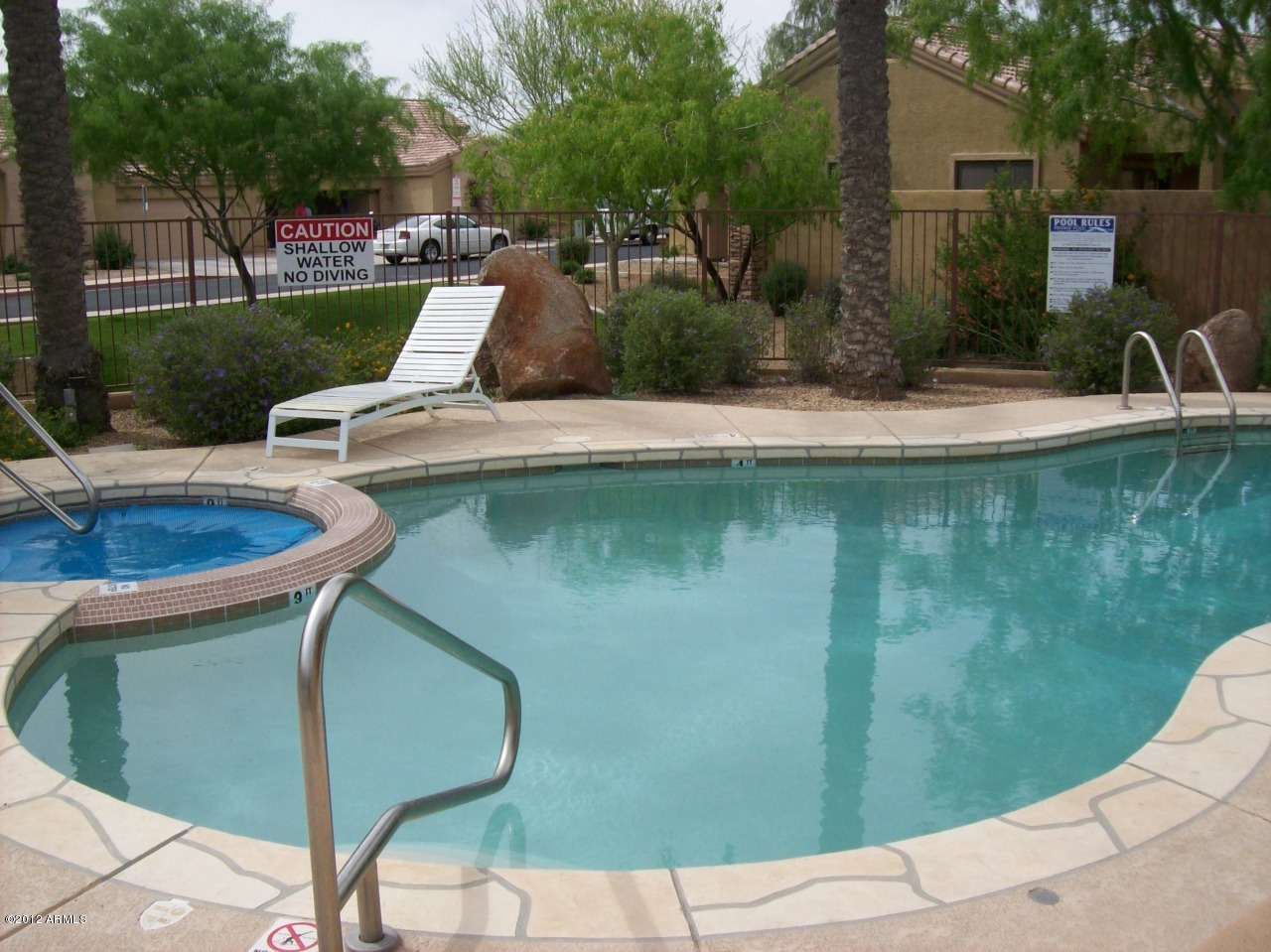 2565 South Signal Butte Road, Unit 39 Mesa, AZ 85209 - Photo 24 of 28 a view of a swimming pool with a patio