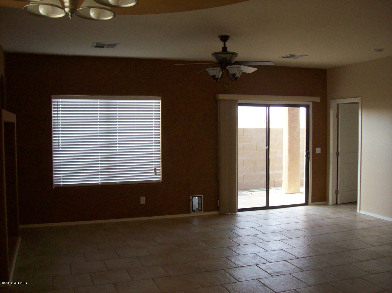 2565 South Signal Butte Road, Unit 39 Mesa, AZ 85209 - Photo 8 of 28 a view of an empty room with a window
