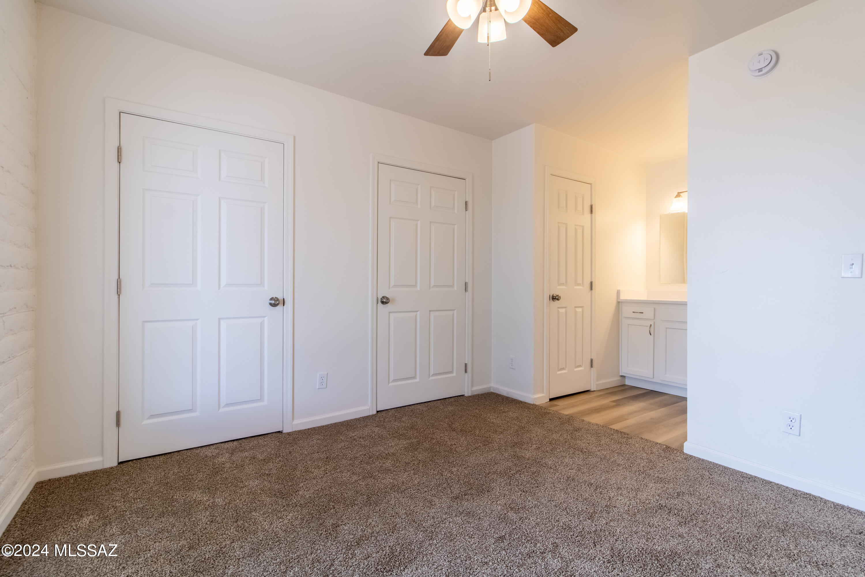 1846 West Dominy Road Tucson, AZ 85713 - Photo 9 of 17 an empty room with chandelier fan