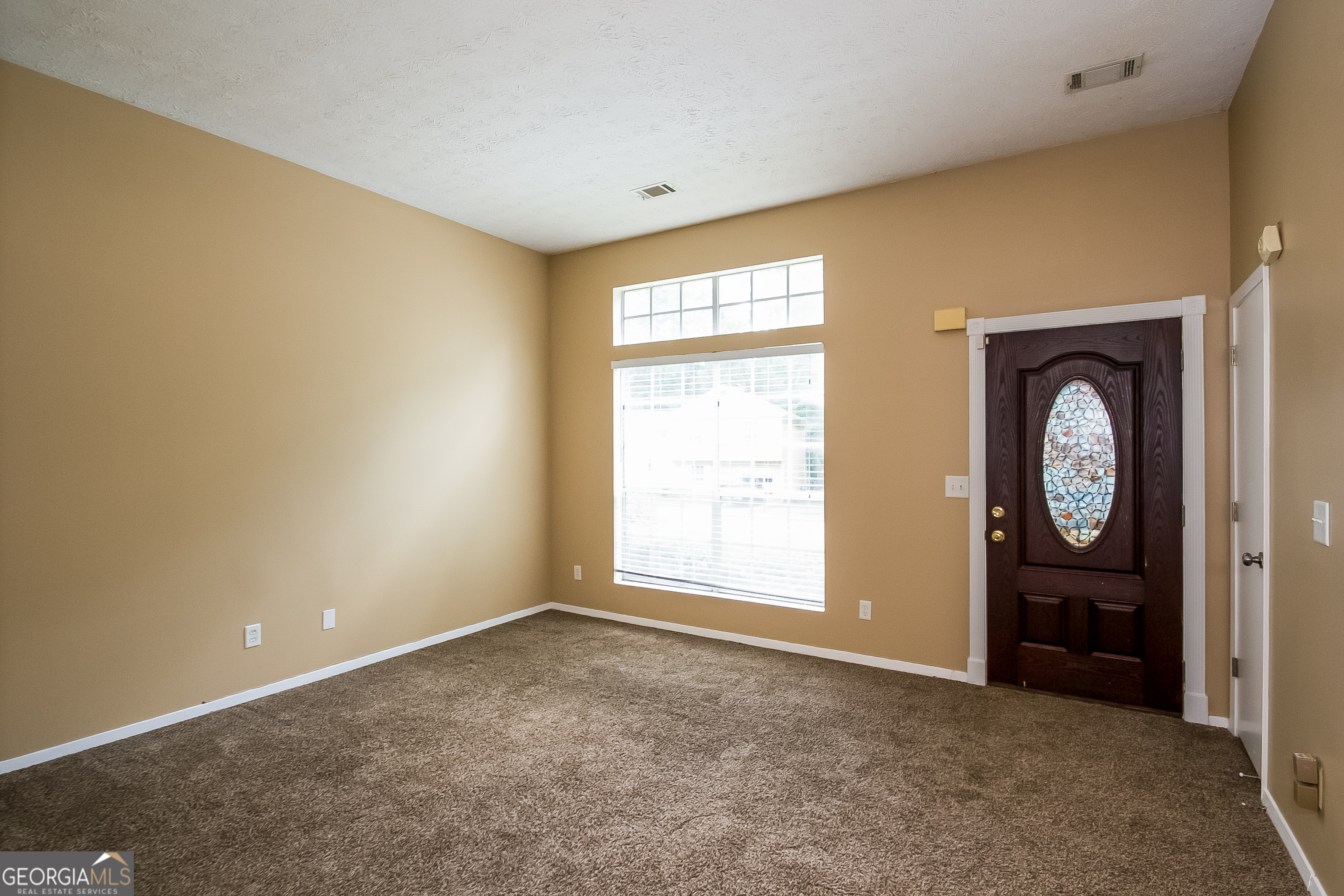 6350 Laurel Post Drive Lithonia, GA 30058 - Photo 2 of 15 a view of empty room with a fireplace