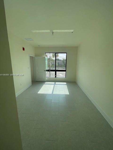 8167 Northwest 41st Street, Unit E111 Doral, FL 33166 - Photo 12 of 14 an empty room with windows and closet