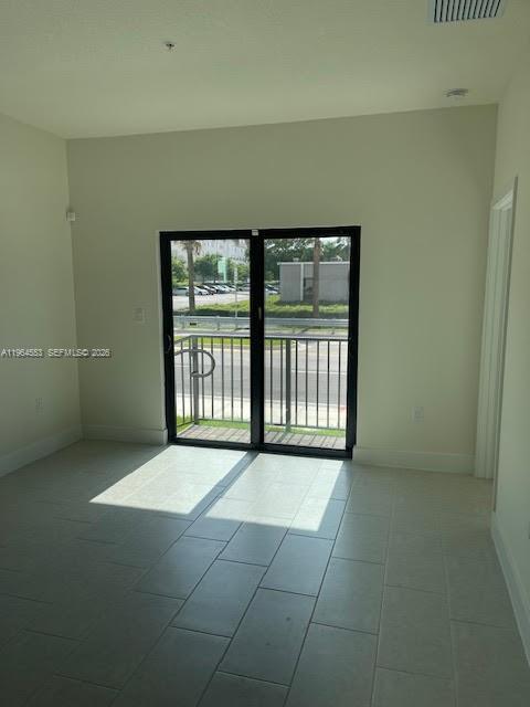 8167 Northwest 41st Street, Unit E111 Doral, FL 33166 - Photo 5 of 14 a view of an empty room with a window