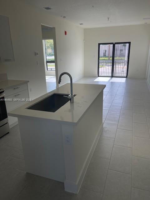8167 Northwest 41st Street, Unit E111 Doral, FL 33166 - Photo 7 of 14 a kitchen with a sink and cabinets