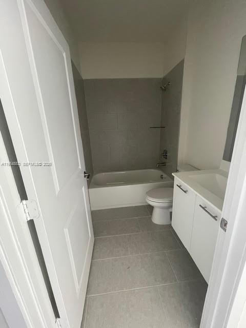 8167 Northwest 41st Street, Unit E111 Doral, FL 33166 - Photo 10 of 14 a bathroom with a sink a toilet and shower