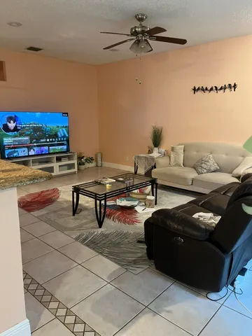 a living room with furniture and a rug