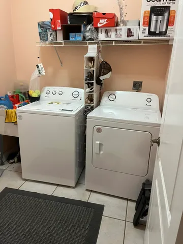 a utility room with dryer and washer