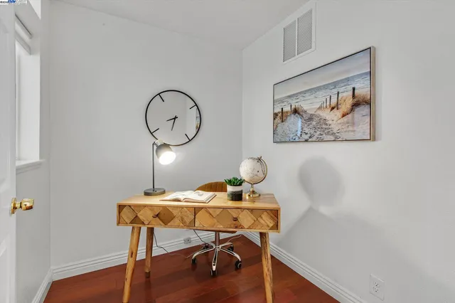 a view of a workspace with furniture