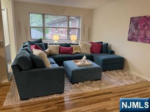 280-320 Oak Street, Unit 304D Ridgewood, NJ 07450 - Photo 6 of 23 a living room with furniture window and a wooden floor