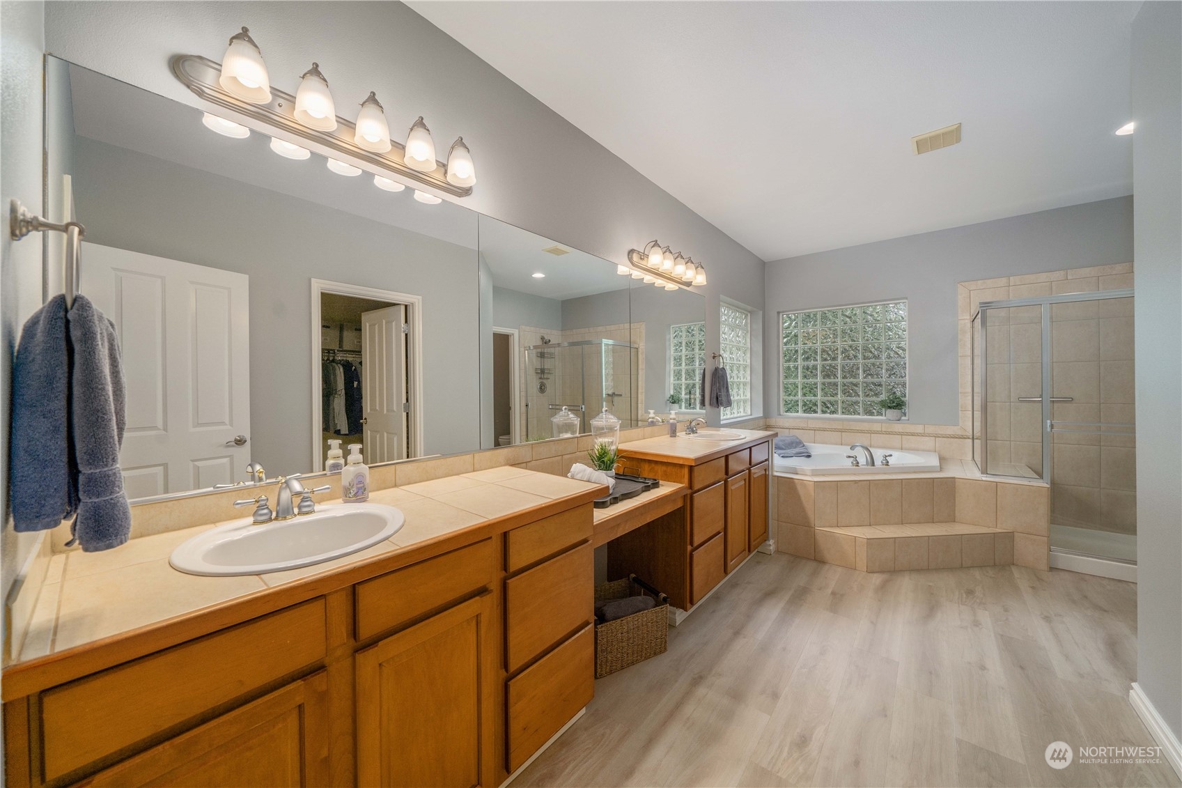 27730 Maple Ridge Way Southeast Maple Valley, WA 98038 - Photo 24 of 39 a large bathroom with a large tub sink vanity granite and a large mirror