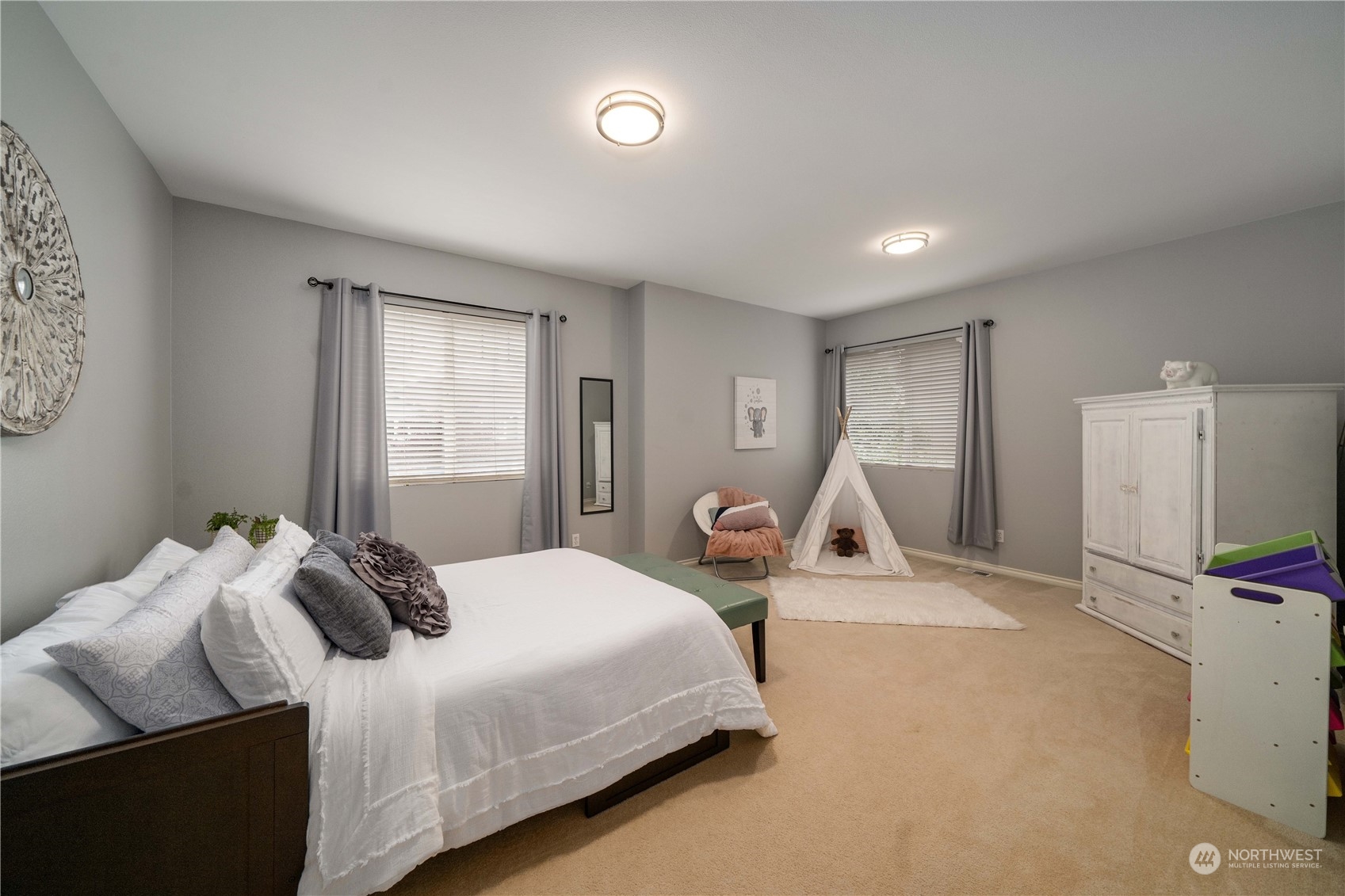 27730 Maple Ridge Way Southeast Maple Valley, WA 98038 - Photo 26 of 39 a bedroom with a bed and flat screen tv