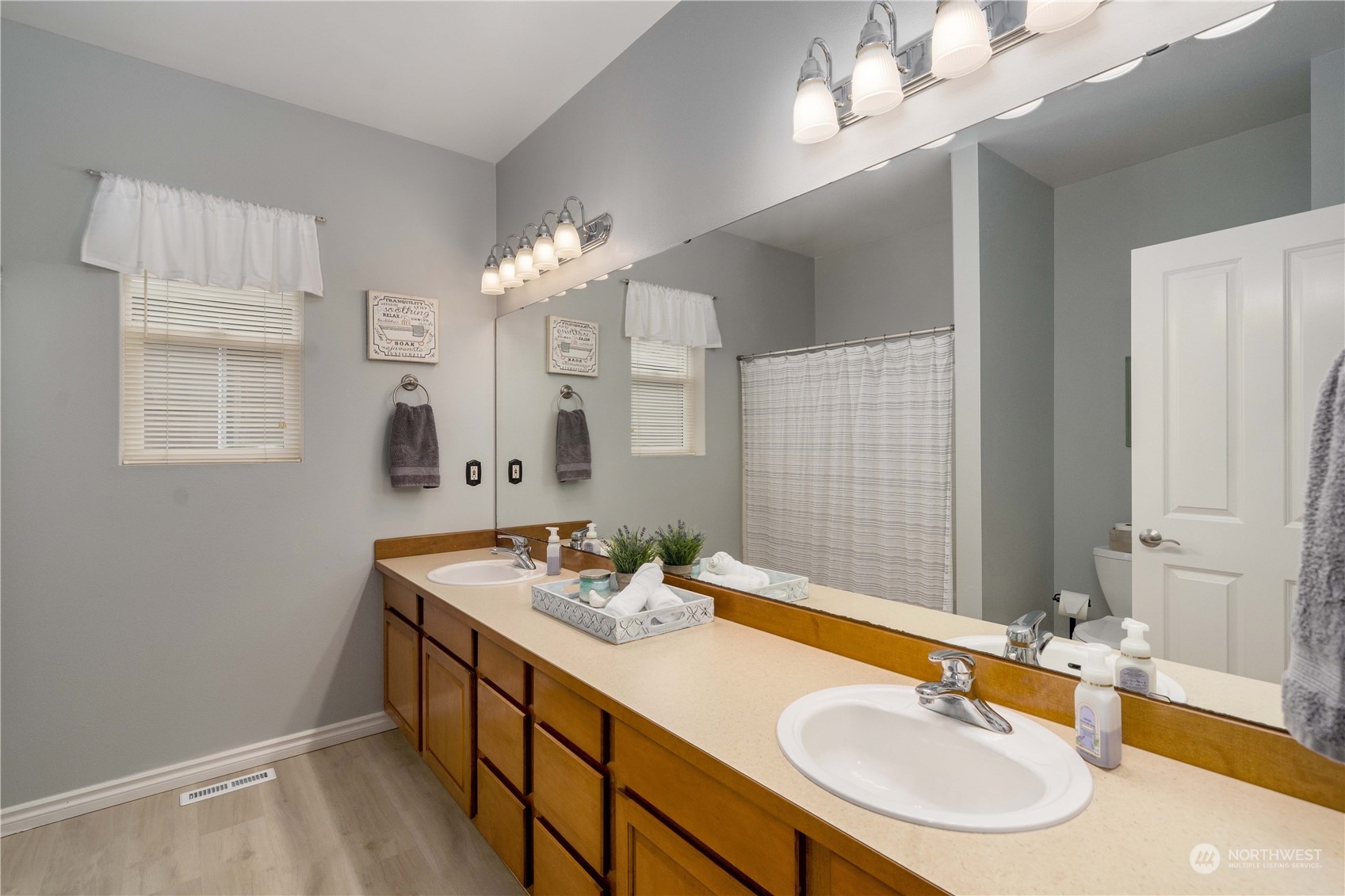 27730 Maple Ridge Way Southeast Maple Valley, WA 98038 - Photo 29 of 39 a bathroom with a sink double vanity granite and a mirror