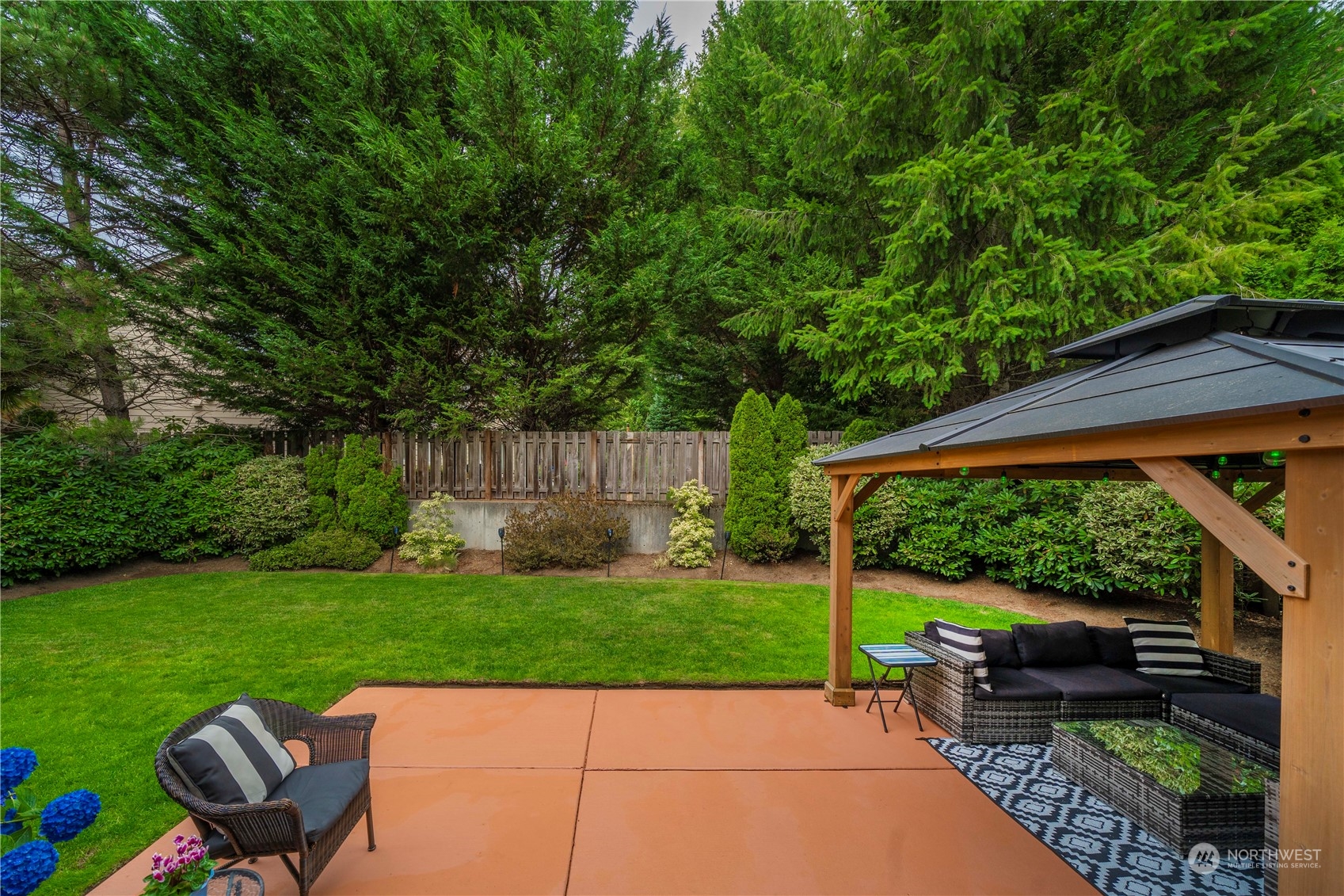 27730 Maple Ridge Way Southeast Maple Valley, WA 98038 - Photo 32 of 39 a backyard of a house with seating space