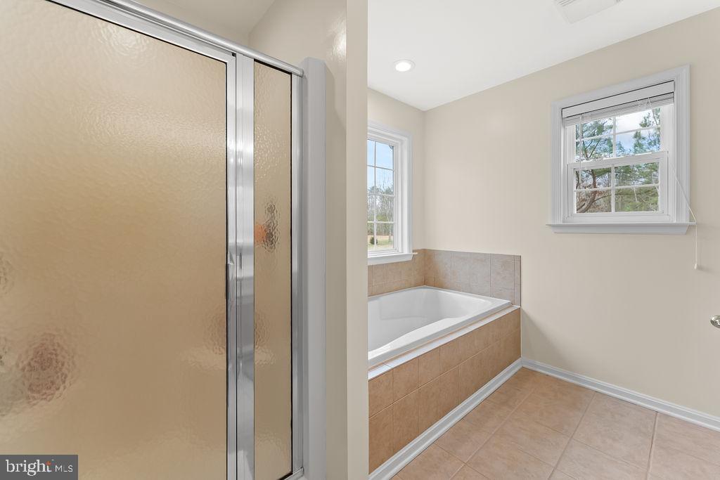 6917 River Road Fredericksburg, VA 22407 - Photo 33 of 89 The Primary Bath has a tub and separate shower.