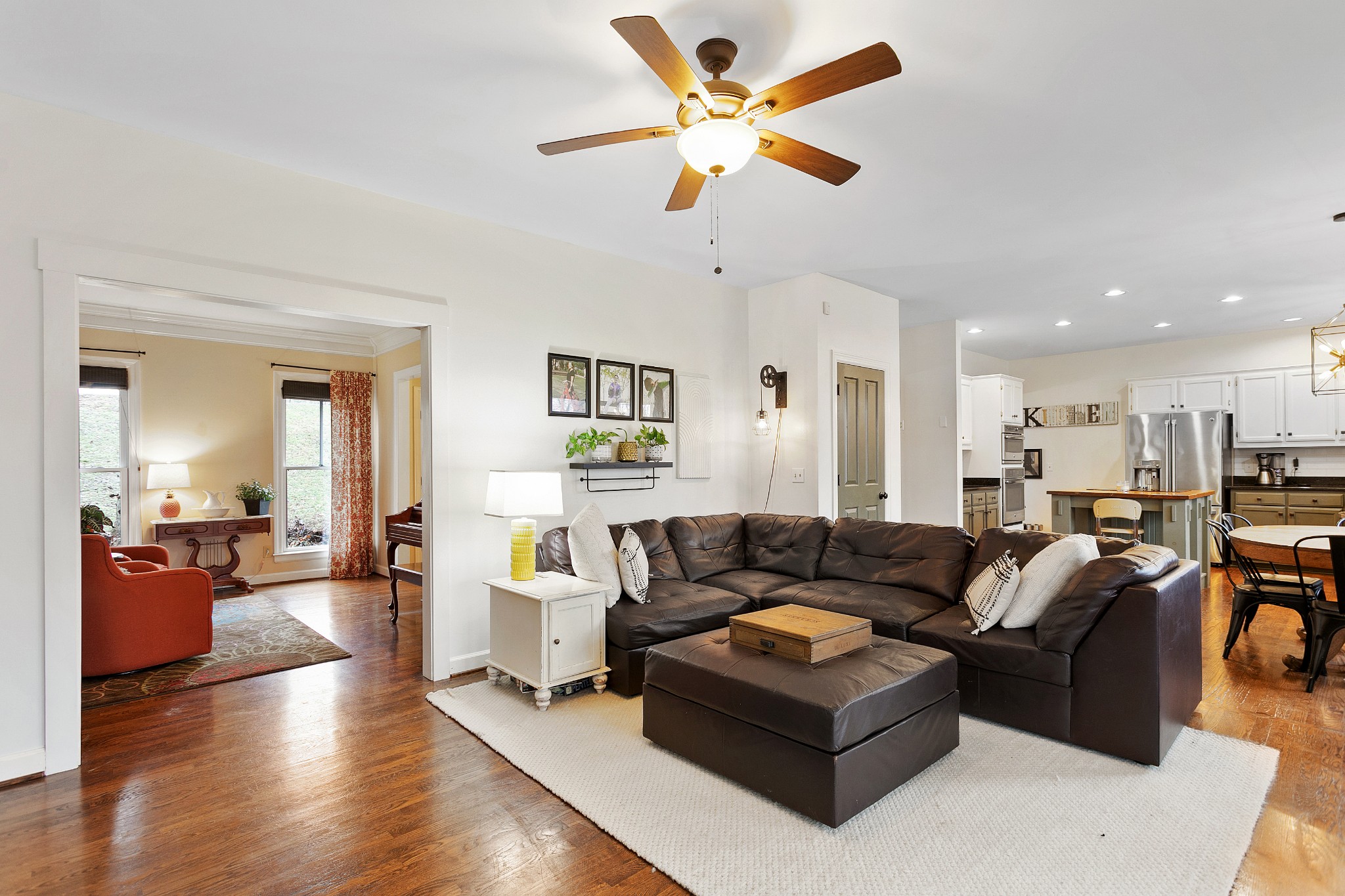 908 High Point Ridge Road Franklin, TN 37069 - Photo 17 of 69 a living room with furniture kitchen view and a wooden floor