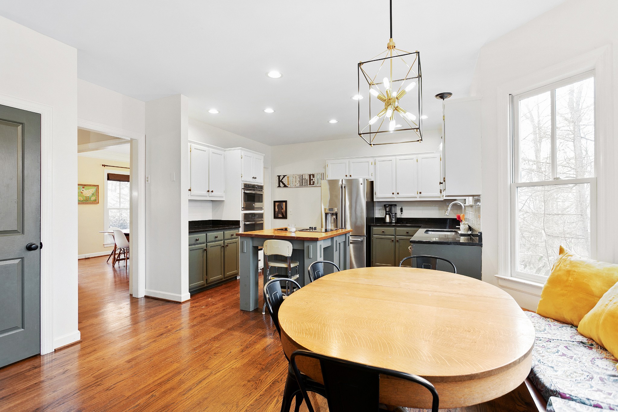 908 High Point Ridge Road Franklin, TN 37069 - Photo 20 of 69 a living room with stainless steel appliances furniture a dining table and kitchen view