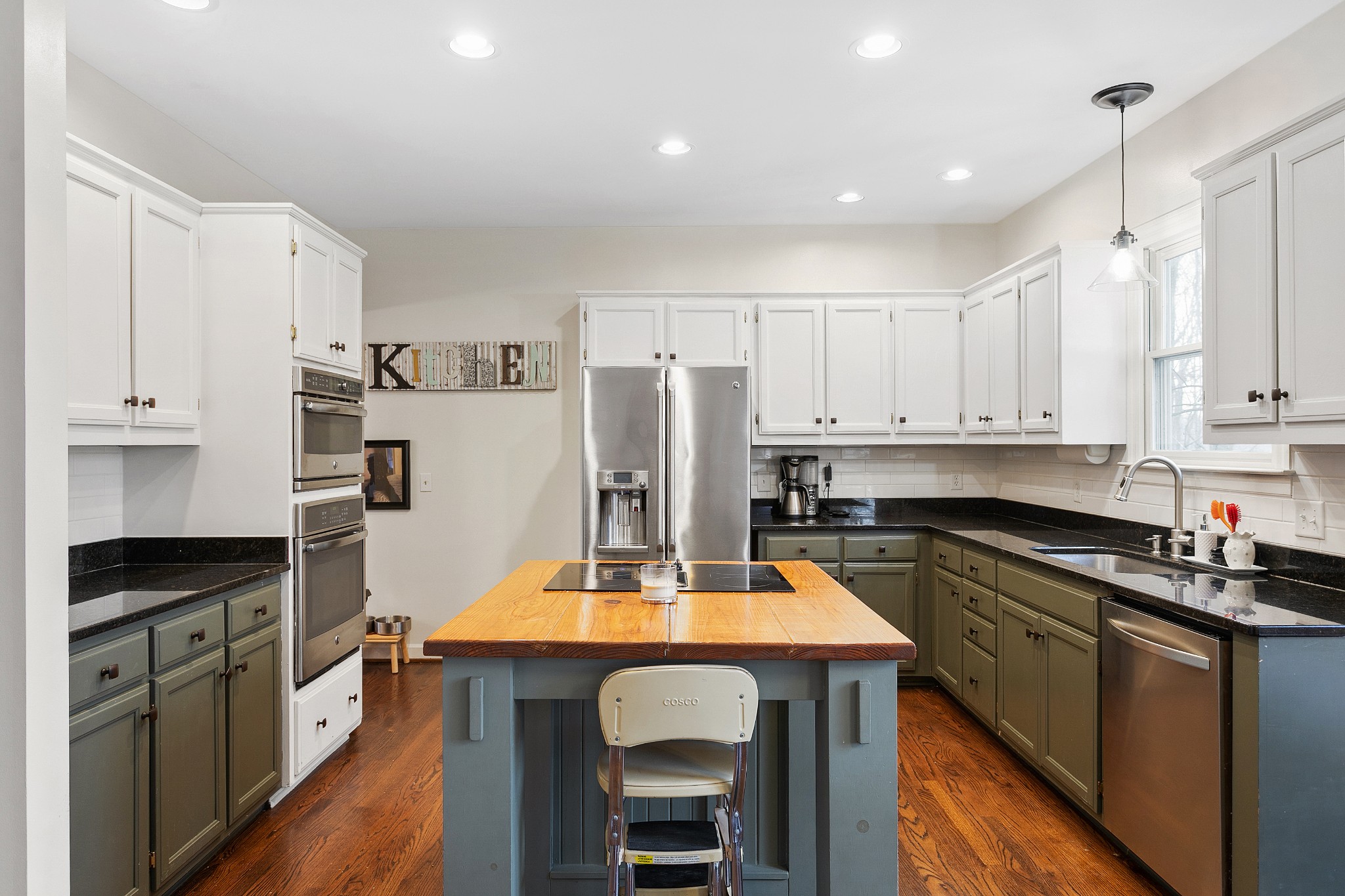 908 High Point Ridge Road Franklin, TN 37069 - Photo 26 of 69 a kitchen with kitchen island granite countertop a sink a counter space stainless steel appliances and cabinets