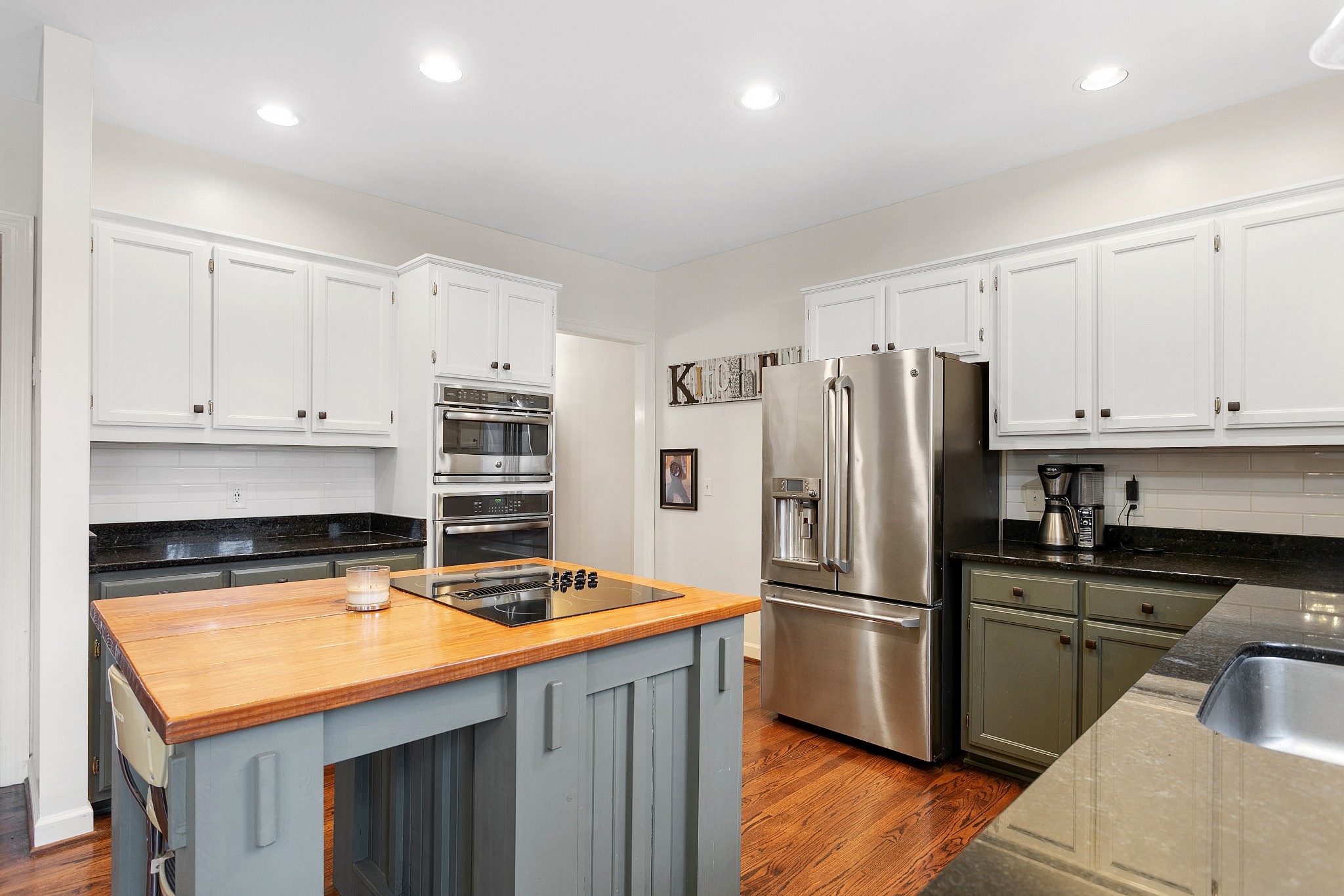 908 High Point Ridge Road Franklin, TN 37069 - Photo 29 of 69 a kitchen with stainless steel appliances granite countertop a refrigerator a stove and a sink