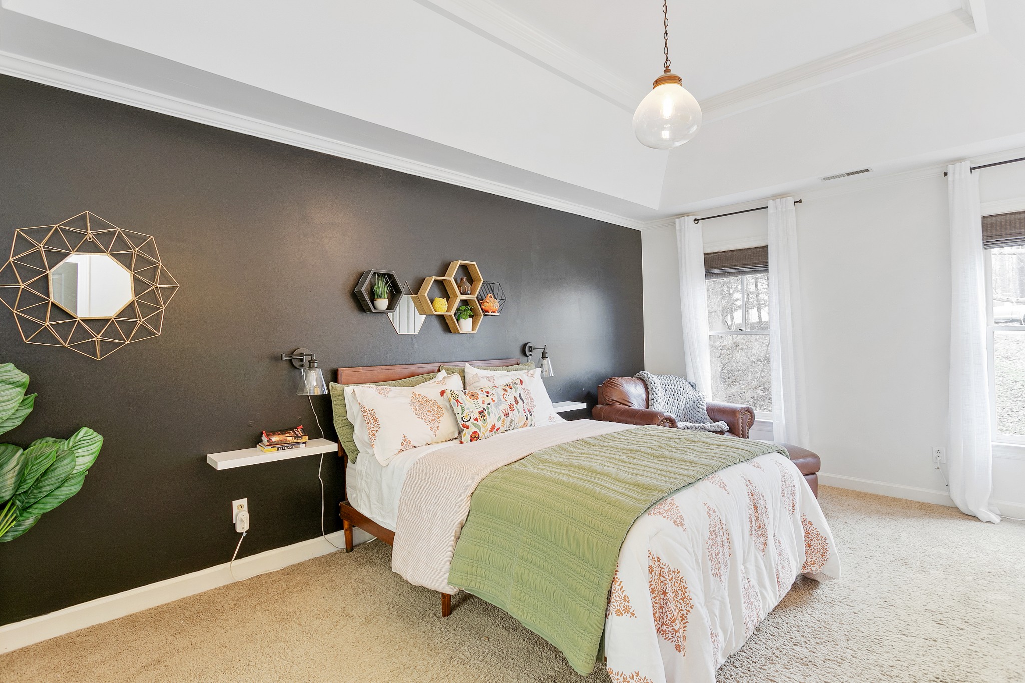 908 High Point Ridge Road Franklin, TN 37069 - Photo 32 of 69 a bedroom with a bed and a chandelier