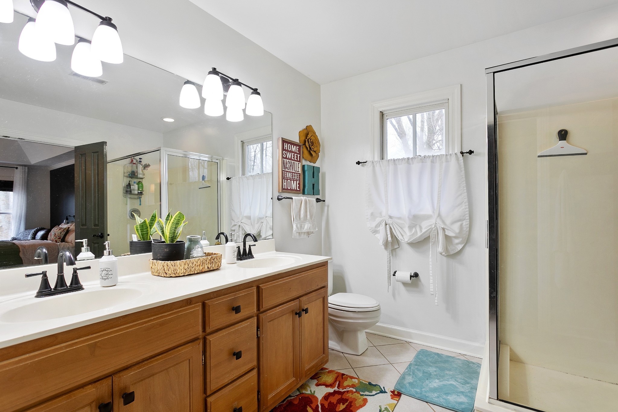 908 High Point Ridge Road Franklin, TN 37069 - Photo 36 of 69 a bathroom with a double vanity sink mirror and toilet