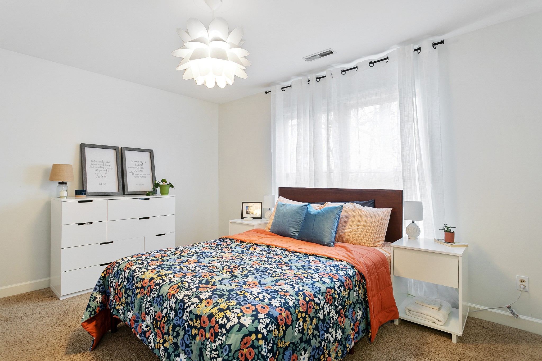 908 High Point Ridge Road Franklin, TN 37069 - Photo 38 of 69 a bedroom with a bed and a chandelier