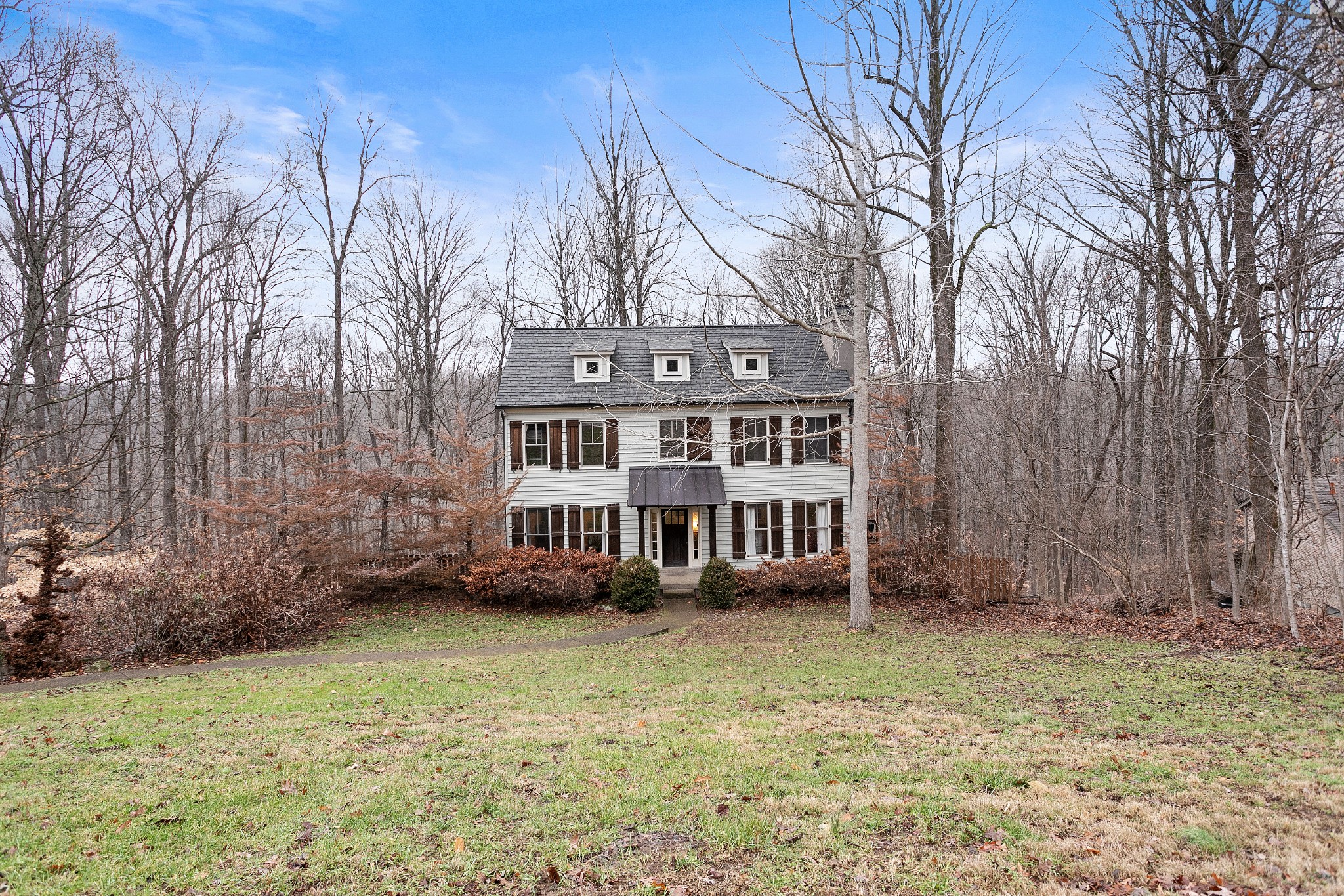 908 High Point Ridge Road Franklin, TN 37069 - Photo 4 of 69 front view of a house with a yard and balcony