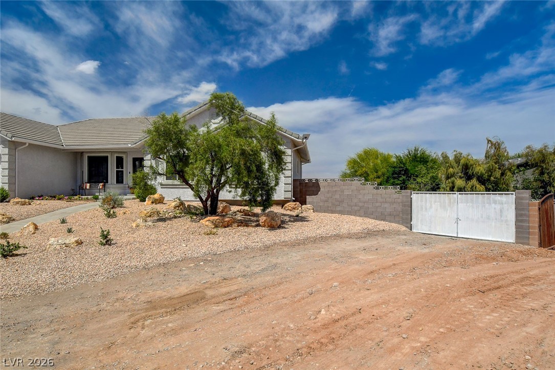 4362 Thistle Street Logandale, NV 89021 - Photo 95 of 99 A desert-friendly landscape surrounds this charming single-story with basement home, featuring dual RV gates.
