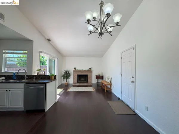 a kitchen with stainless steel appliances a sink stove and cabinets