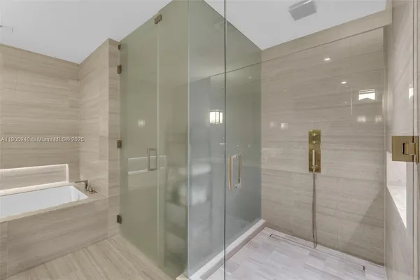 a spacious bedroom with a bed and a large window