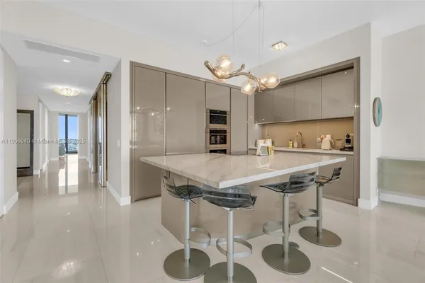 a kitchen with a table and chairs in it