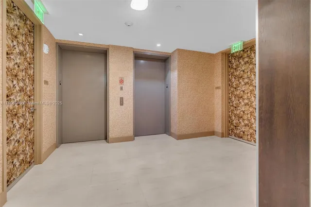 a dining room with furniture and a large window