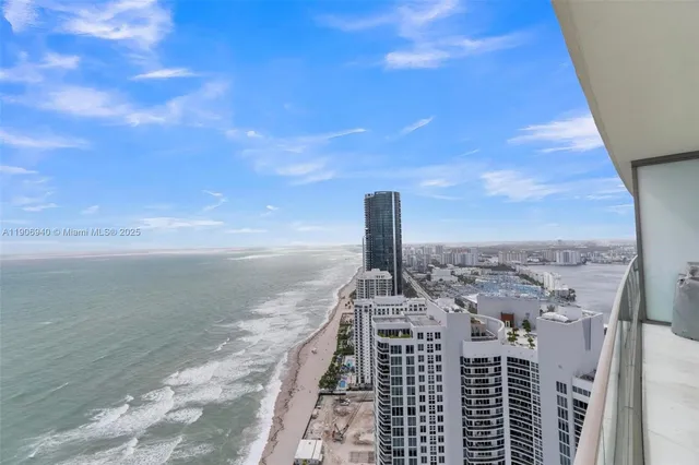 a view of a balcony with an ocean
