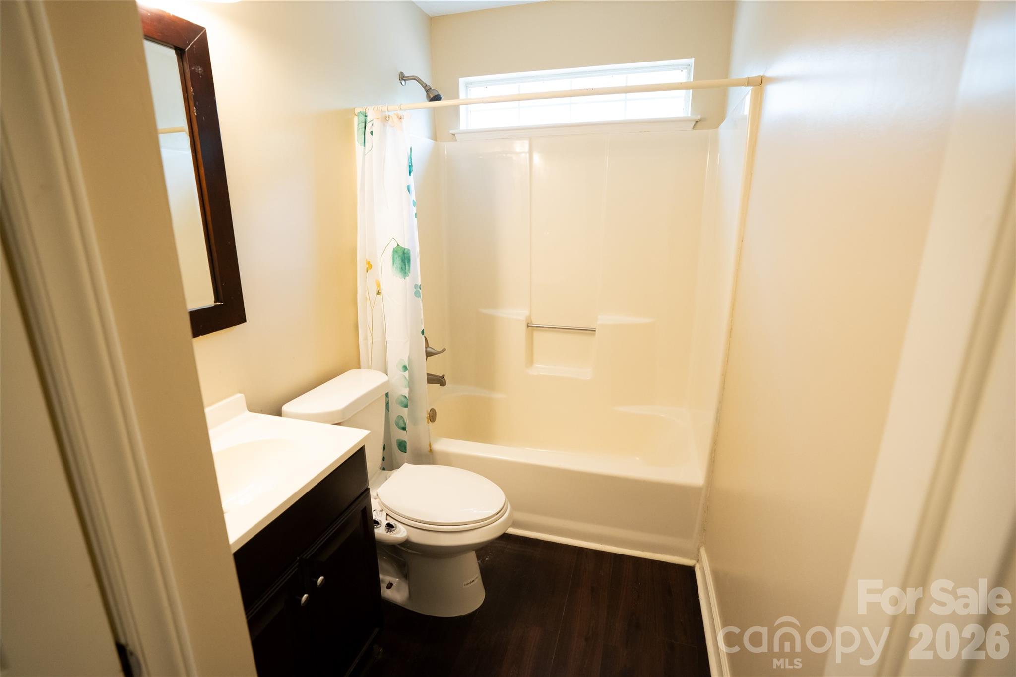 10737 Spruce Mountain Road Charlotte, NC 28214 - Photo 12 of 19 a bathroom with a toilet and a shower