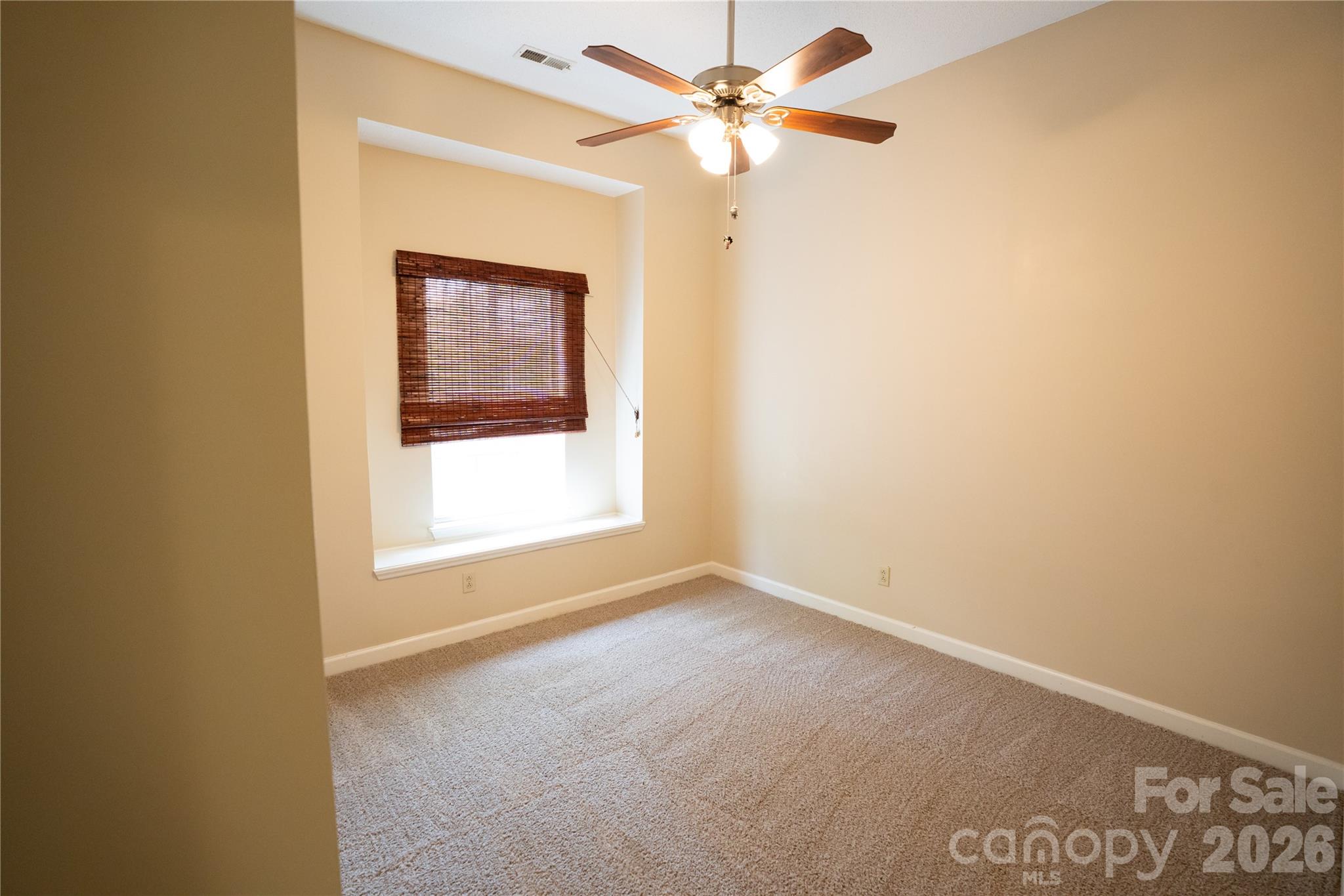 10737 Spruce Mountain Road Charlotte, NC 28214 - Photo 13 of 19 a view of an empty room with a window