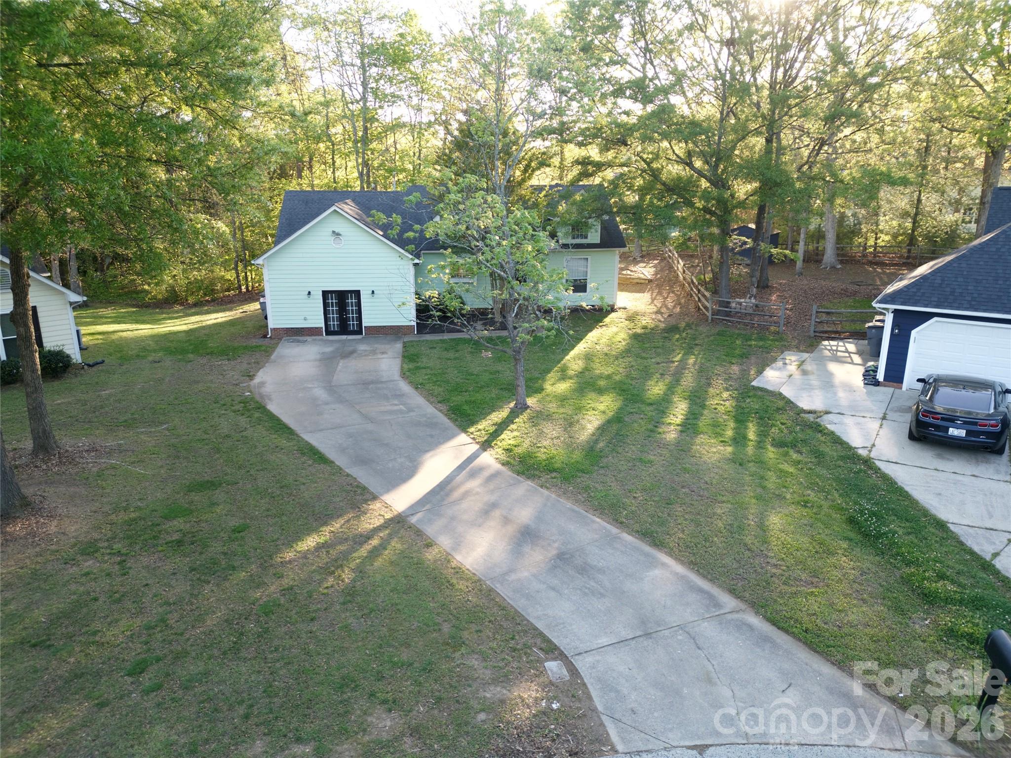10737 Spruce Mountain Road Charlotte, NC 28214 - Photo 2 of 19 a view of back yard of the house